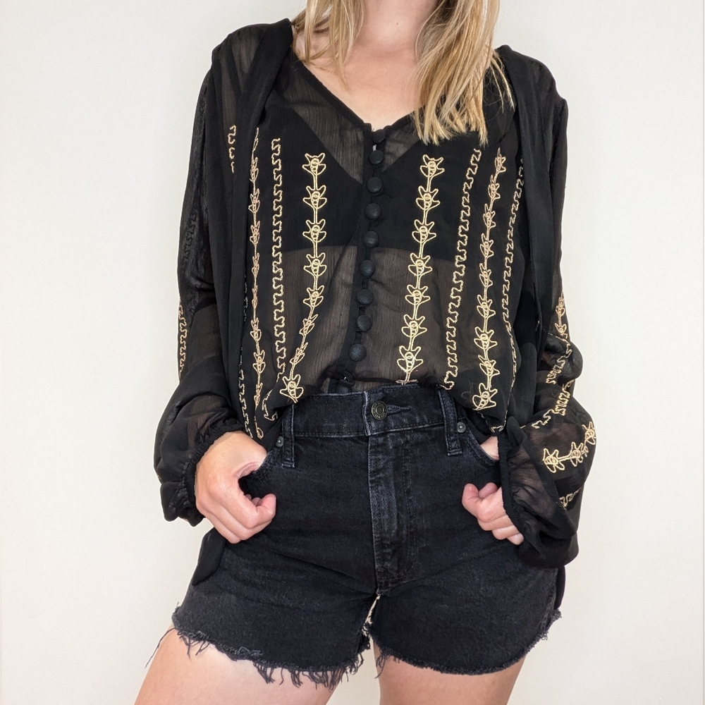 Sheer black top with tie collar and gold embroidery